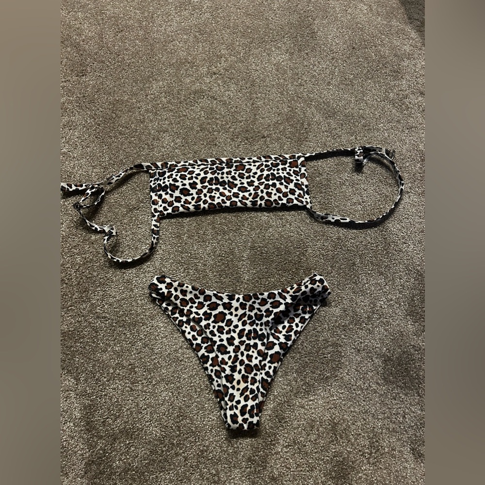 Two swimsuit sets. Cheetah and reptile print.